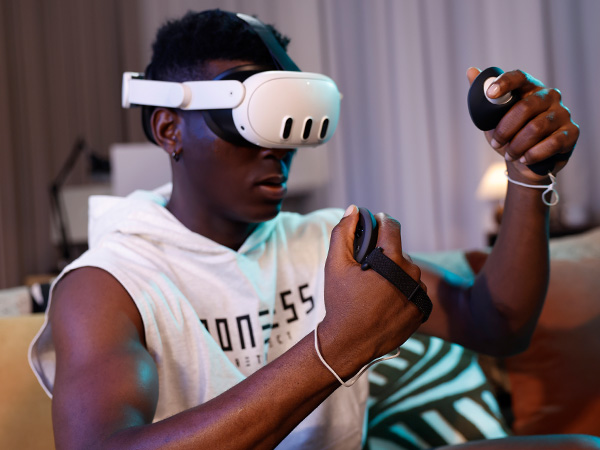 A person enjoying virtual reality experience with KIWI design G4 Pro in a stylishly decorated room.