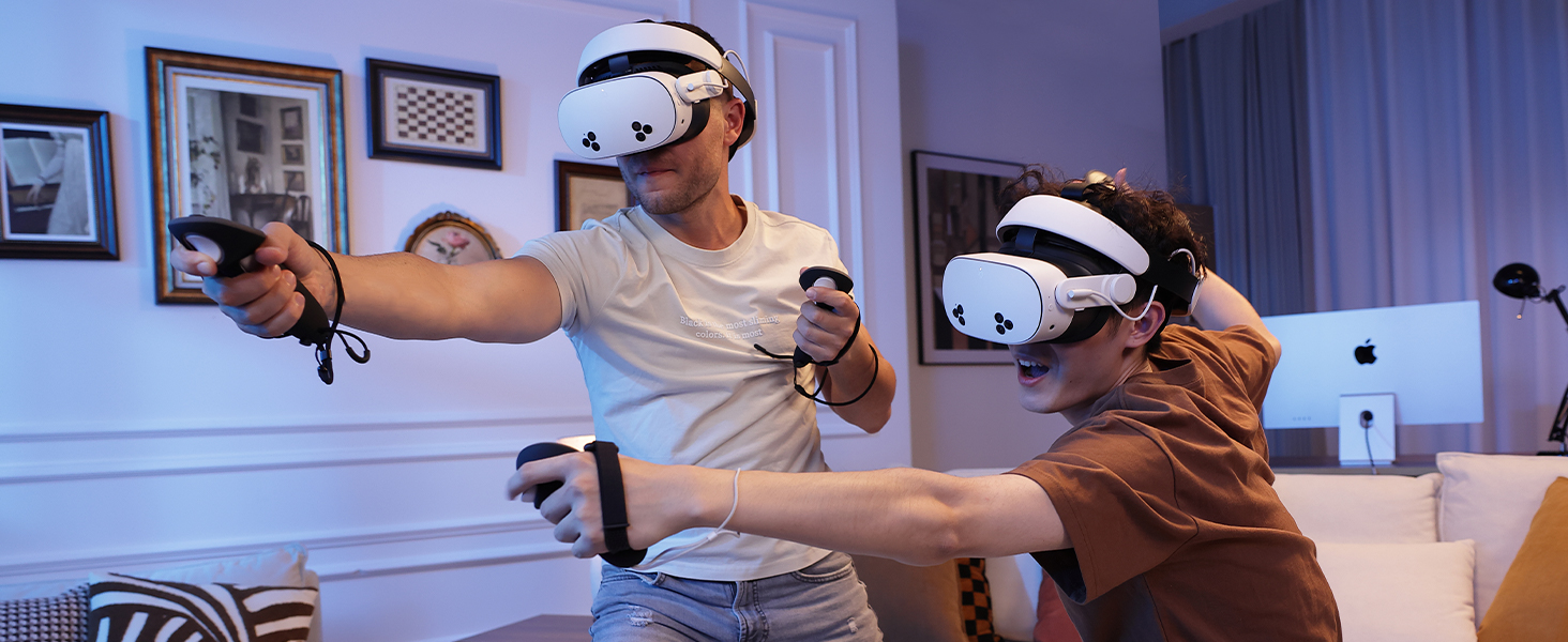 Two individuals playing VR games with H4 Boost Halo Battery Strap
