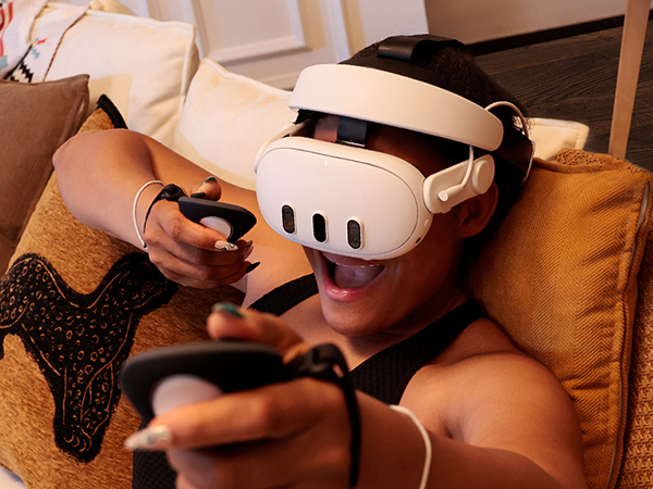 Person experiencing virtual reality technology at home.